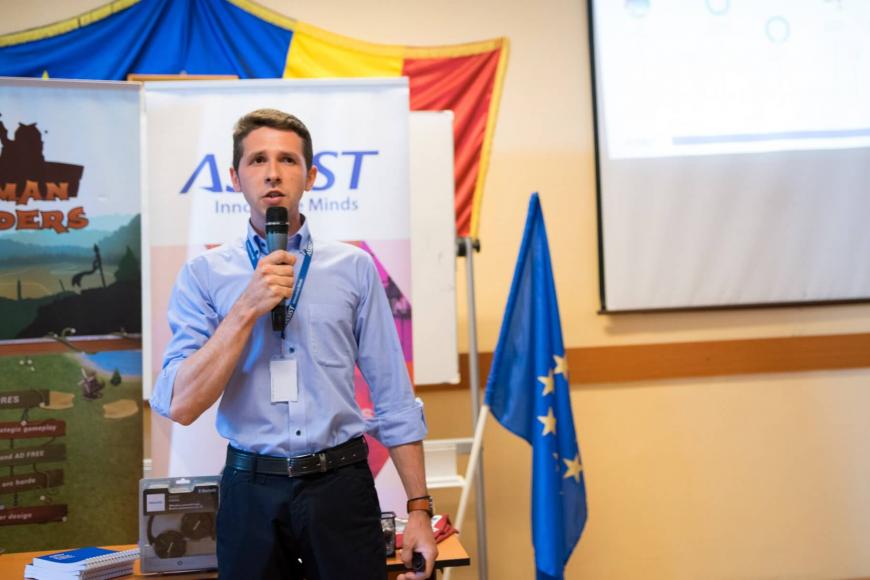 Representative of ASSIST Software sustaining presentations in front of the pupils 